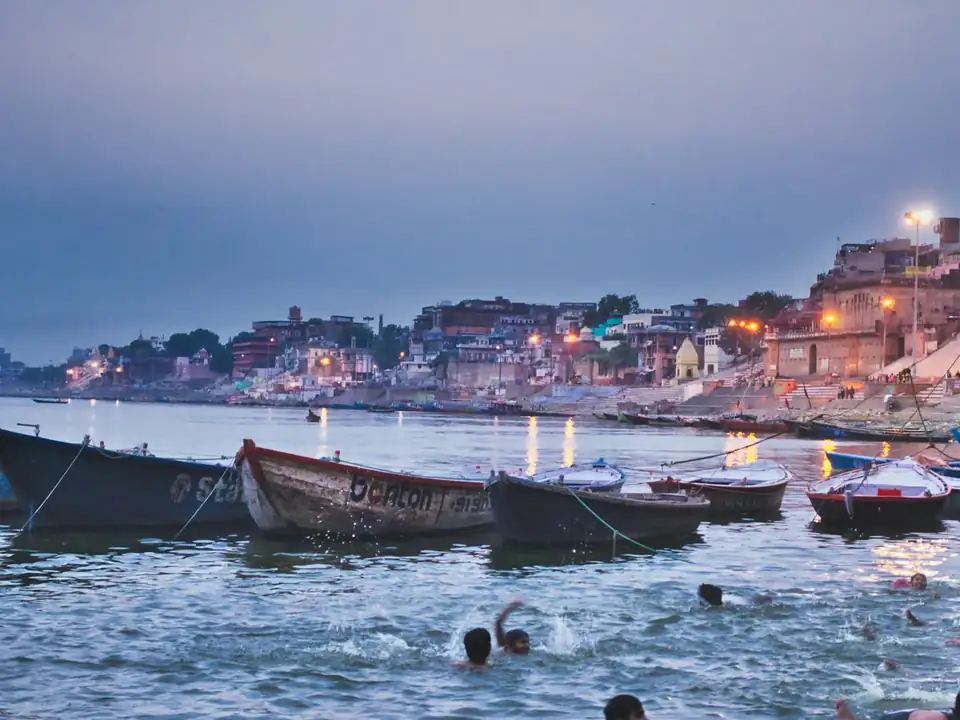 Boats on the Ganga along the ghats of Varanasi at dusk