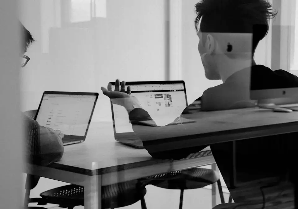 Consultant reviewing property details on a laptop
